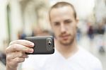 male Photographer With Mobile Phone Stock Photo