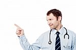 Male Physician Pointing His Finger Right Stock Photo