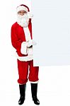 Male Santa Holding Whiteboard Stock Photo