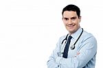 Male Surgeon Posing With Folded Arms Stock Photo