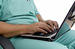 Male Surgeon Working On Laptop Stock Photo