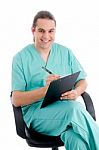 Male Surgeon Writing Prescription Stock Photo