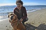 Man And Dog In Autumn Stock Photo