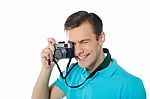 Man Clicking With Digital Camera Stock Photo