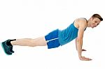 Man Doing Push-ups Exercise In Gym Stock Photo