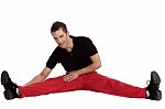 Man Doing Streching Exercise Stock Photo