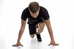 Man Doing Stretching Exercise Stock Photo