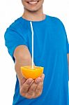 Man Giving Orange Juice Stock Photo