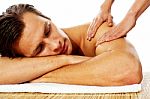 Man Having Massage In A Spa Center Stock Photo