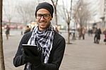 Man Holdin I-pad Tablet Computer On Street Stock Photo