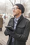 Man Holdin I-pad Tablet Computer On Street Stock Photo