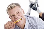 Man Holding Pencil With Teeth Stock Photo