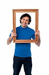 Man Holding Wooden Picture Frame Stock Photo