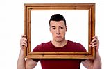 Man Holding Wooden Picture Frame Stock Photo