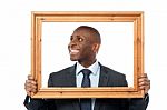 Man Holding Wooden Picture Frame Stock Photo