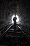 Man In A Tunnel Looking Towards The Light Stock Photo