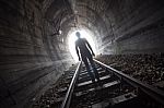 Man In A Tunnel Looking Towards The Light Stock Photo