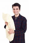 Man In Pajamas Holding Pillow Stock Photo