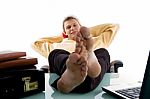 Man In Relaxing Mode Having Legs On Desk Stock Photo