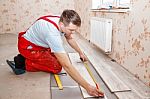 Man Laying Laminate Flooring Stock Photo