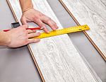 Man Laying Laminate Flooring Stock Photo