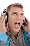 Man Listening Through Headphone Stock Photo