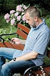 Man Looking At Smartphone Stock Photo