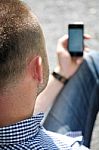 Man Looking At Smartphone Stock Photo