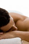 Man Lying Down For Spa Treatment Stock Photo