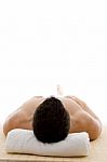 Man Lying Down For Spa Treatment Stock Photo