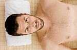 Man Lying Down For Spa Treatment Stock Photo