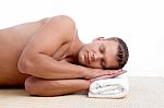 Man Lying On Mat To Take Spa Stock Photo