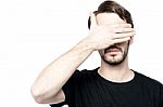 Man Making See No Evil Gesture Stock Photo