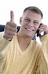 Man On Phone Giving Thumbs Up Stock Photo