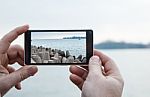 Man Photographs A Mobile Phone Stock Photo