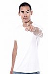 Man Pointing Front Over White Background Stock Photo