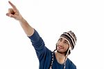 Man Pointing Up With Cap Stock Photo