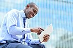 Man Reading News On His Tablet Pc Stock Photo