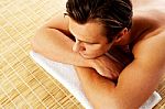 Man Relaxing In A Spa Resort On Mat Stock Photo