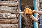 Man Sawing A Window Stock Photo