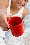 Man Showing Coffee Mug Stock Photo