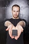 Man Showing Smartphone Stock Photo