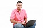 Man Sitting On Floor With Laptop Stock Photo