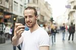 Man Taking Photo With Mobile Phone Stock Photo