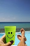 Man With A Drink Over The Sea Stock Photo