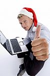 Man With Christmashat And Laptop Stock Photo