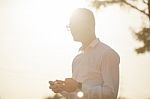 Man With Glasses Speak On Mobile Phone In Hands Stock Photo