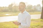 Man With Glasses Speak On Mobile Phone In Hands Stock Photo