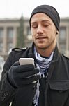 Man With Mobile Phone In Hands Stock Photo