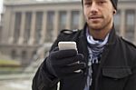 Man With Mobile Phone In Hands Stock Photo